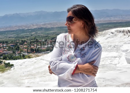 Tourist in white clothes in Pamukkale