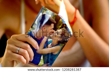 Burning photography kissing newlywed. Broken heart woman. Couple break up. Sad bride on unhappy wedding. Woman and groom quarrel. Girl burns in fire candle family pictures.