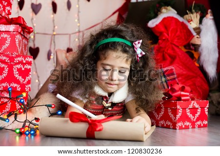 Girl writing a letter for santa