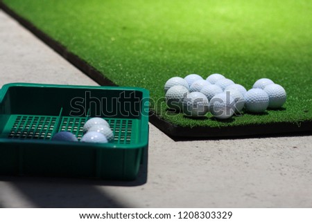 golf balls on the green grass