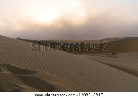 Just as the Sun is Beginning to Set, an Approaching Sandstorm is visible, Dammam, Eastern Province, Saudi Arabia
