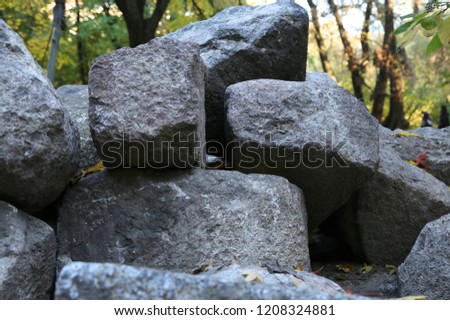 huge stones boulders natural the friend on the friend for processing and work with them of gray color
