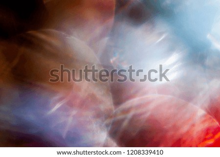 Abstract view of light beams in soft focus on bokeh background 