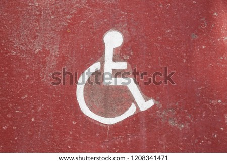 Disability icon on grunge background, floor of underground garage .
