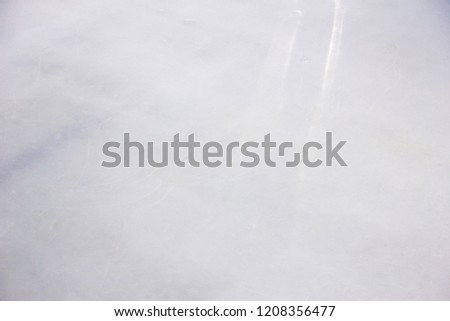 Ice rink floor, Frozen scratched background and texture.