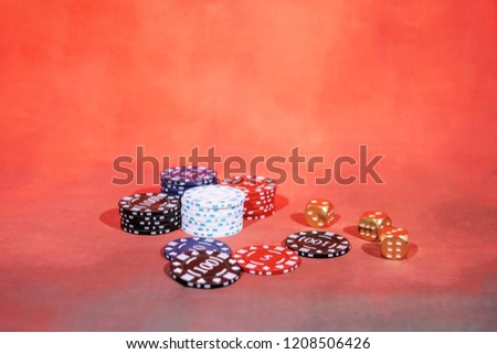 Casino abstract photo. Poker game on red background.  Theme of gambling.