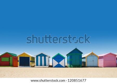 Beautiful small bathing houses on white sandy beach at Brighton Beach, Australia Royalty-Free Stock Photo #120851677