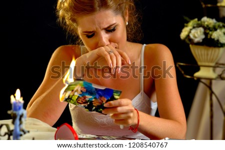 Burning photography kissing newlywed. Wedding memories. Broken heart woman. Couple break up. Sad bride on unhappy wedding. Relationships have not become fairy tale. Portrait crying female. Family has
