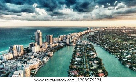 Miami Beach, wonderful aerial view of buildings, river and vegetation.