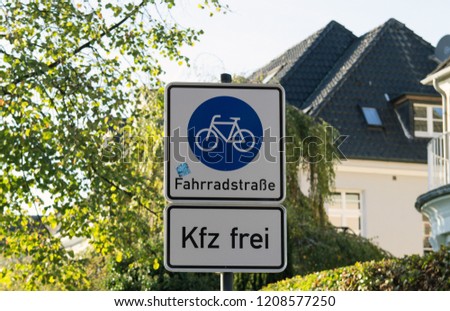 Bicycle and pedestrian lane road sign on pole post.