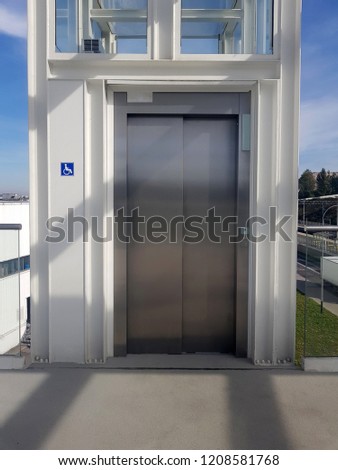 Modern automatic elevator, lift for the disabled, sign on the wall