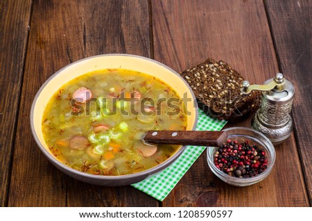 Soup with lentils, sausages and vegetables. Studio Photo