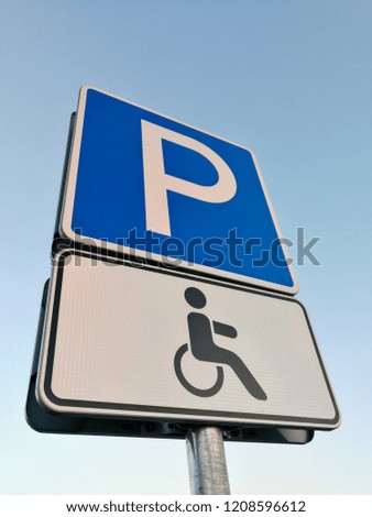 European disabled people parking sign in front of blue sky