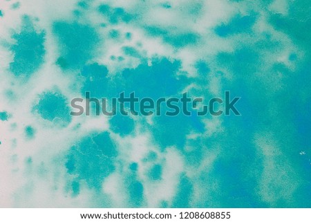 Watercolor background with small blue specks. aquamarine