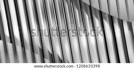 Lath structure of ceiling, wall or roof. Black and white close-up photo of modern architecture or interior fragment with shadows. Abstract architectural background in chiaroscuro technique. Royalty-Free Stock Photo #1208633398