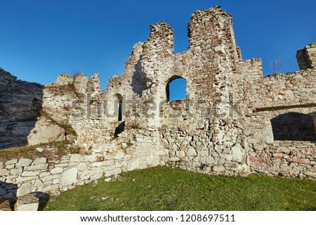 Ruined medieval castle wall detail Royalty-Free Stock Photo #1208697511