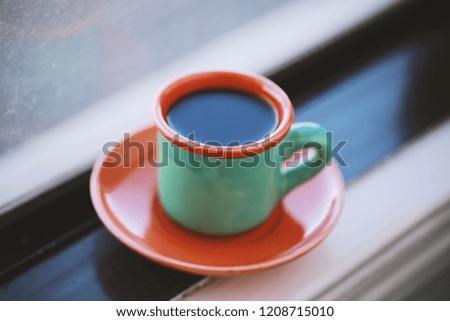 green vintage cup of coffee,cold and hot coffee with steam and leaf , waiting time for love 