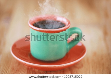 green vintage cup of coffee,cold and hot coffee with steam and leaf , waiting time for love 