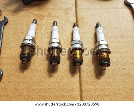 The old spark plug after remove from car