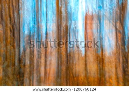 Blurred Tree Trunks At A City Park With Golden Autumn Leaves. Intentional Camera Movement ICM. Fall Fine Art Design.