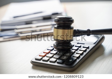 Judge hammer and business report papers, important documents