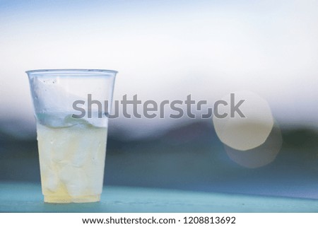 The background of ice cold water and soft drinks (soft drinks, beer, liqueurs, drinking water) has the vapor dispersed around the glass, a beautiful one, the colorful wallpapers of bubbles.