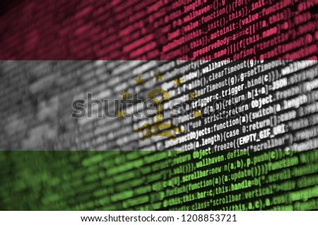 Tajikistan flag  is depicted on the screen with the program code. The concept of modern technology and site development