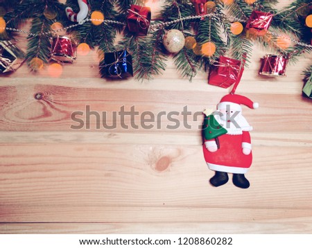 christmas background with santa garland on wooden board