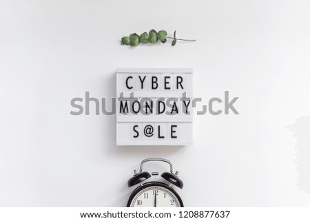 Creative Top view flat lay promotion composition Cyber Monday sale text on lightbox alarm clock white background copy space Template Cyber Monday sale mockup fall thanksgiving promotion advertising