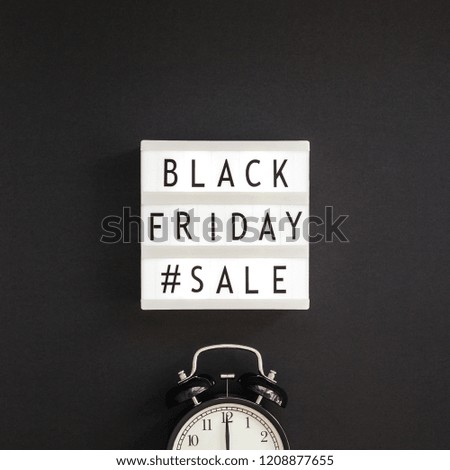 Creative Top view flat lay promotion composition Black friday sale text on lightbox alarm clock black background copy space Square Template Black friday sale mockup fall thanksgiving advertising