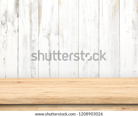 Vintage wooden table in white wall room. Royalty-Free Stock Photo #1208903026
