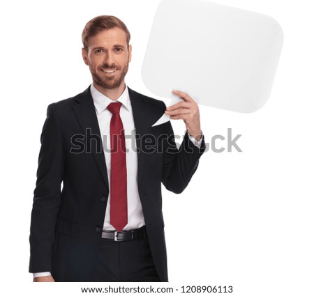 joyful businessman standing on white background and holding up white speech bubble, portrait picture