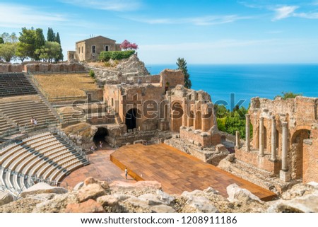 Ruins of the Ancient Greek Theater in Taormina on a sunny summer day with the mediterranean sea. Province of Messina, Sicily, southern Italy. Royalty-Free Stock Photo #1208911186