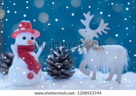  Christmas snowman and deer in the snow