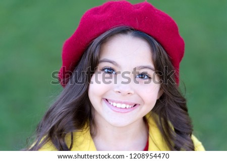 French trend fall season. Charming french style fashionable girl. Fall fashion concept. Hat accessory french fashion detail. Kid girl bright hat beret long curly hair. Fall hat fashion accessory.