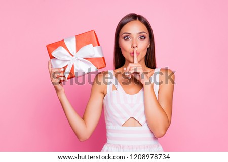 This is confidential information! Brunette feminine lady she hold big red case box with white ribbon make shh sign isolated on vivid pink pastel background in fancy summer spring striped wear