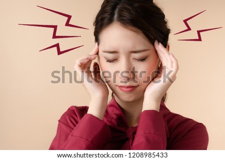 Young woman having a headache.