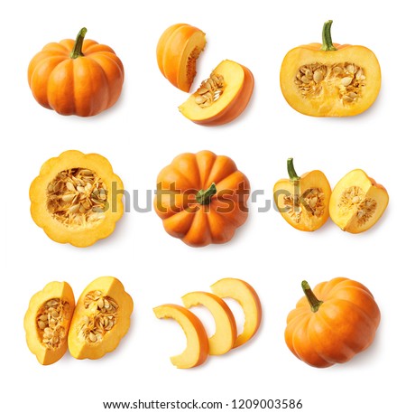 Set of fresh whole and sliced pumpkin isolated on white background. Top view Royalty-Free Stock Photo #1209003586