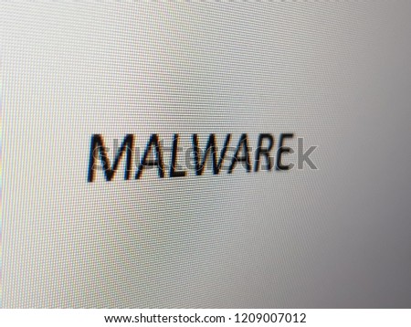 Closeup of pixelated malware wording on a computer screen