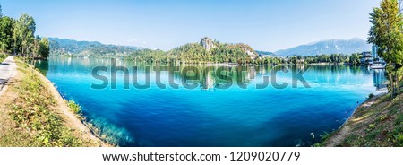 Panoramic photo of Lake Bled with castle, Slovenia, Europe. Travel destination. Summer vacation.