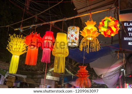 A streetside shop selling traditional lanterns before Diwali festival in India.