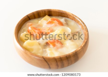 White stew in a wooden dish