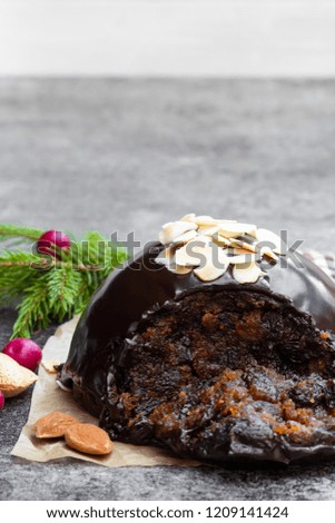 Homemade  Christmas pudding on gray stone background 