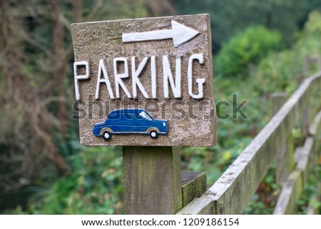 A car parking sign at a youth hostel