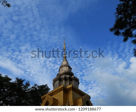 Golden Pagoda on the sky background, of Northern Thailand Temple