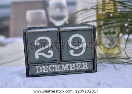 Wood blocks in box with date, day and month 29 December. Wooden blocks calendar