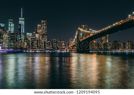 New York skyline from Brooklyn. Panoramic view of Manhattan at night.
