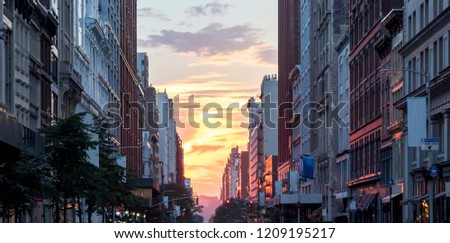 Colorful sunset sky between the buildings of Midtown Manhattan in New York City NYC