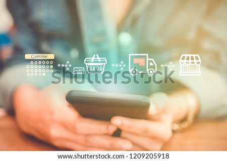 Women hand using smartphone do shopping online store with various doodle icons pop up. Social media maketing concept.