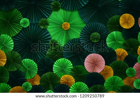 Green and yellow and pink papers texture flowers paper background pattern made from paper with copy space for ideas of love. Or any other abstract background.